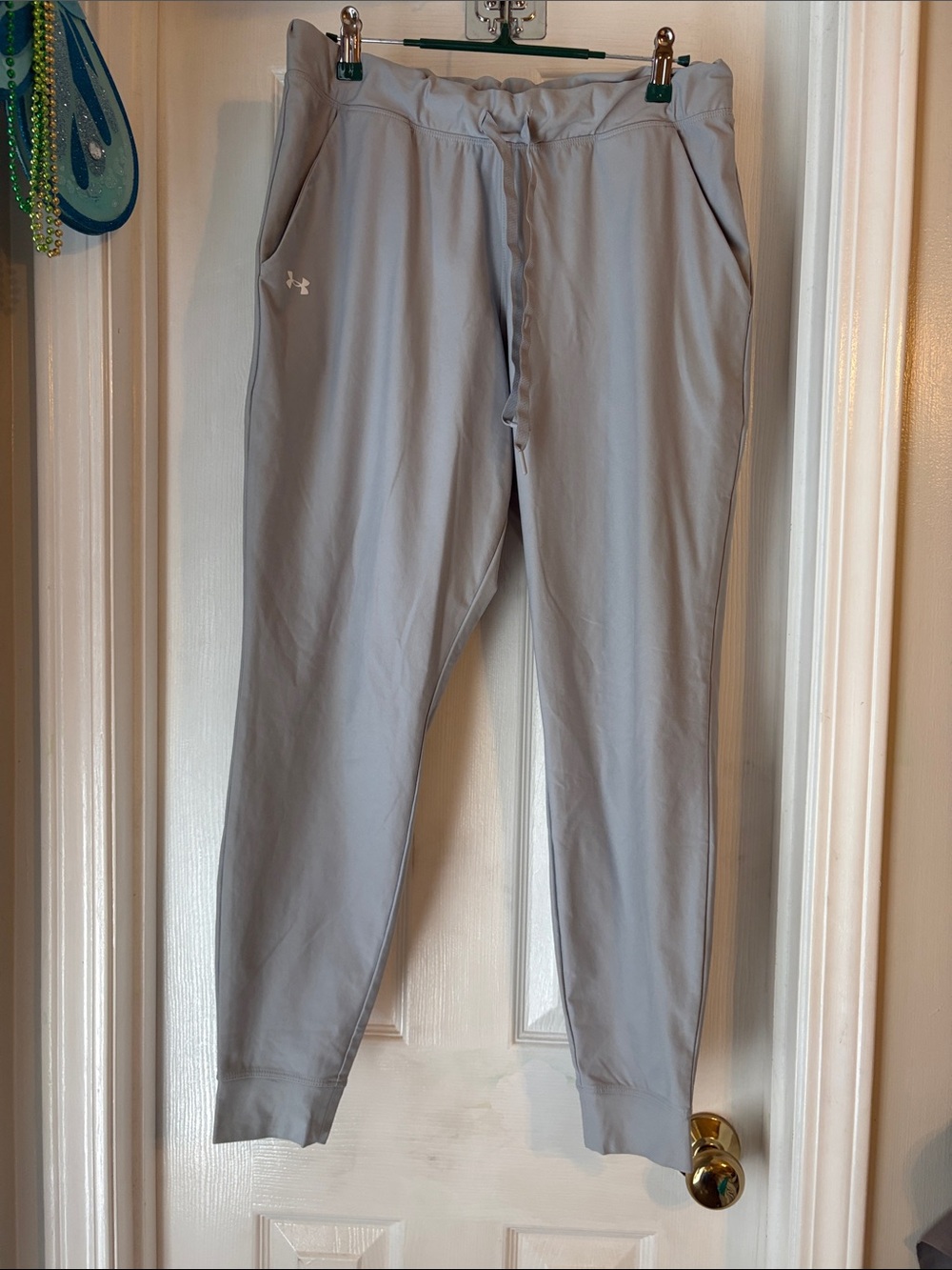 Under Armour women’s mid rise light grey joggers size medium.